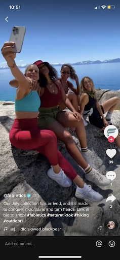 @ fabletics with four women at the top of a mountain posing for a picture